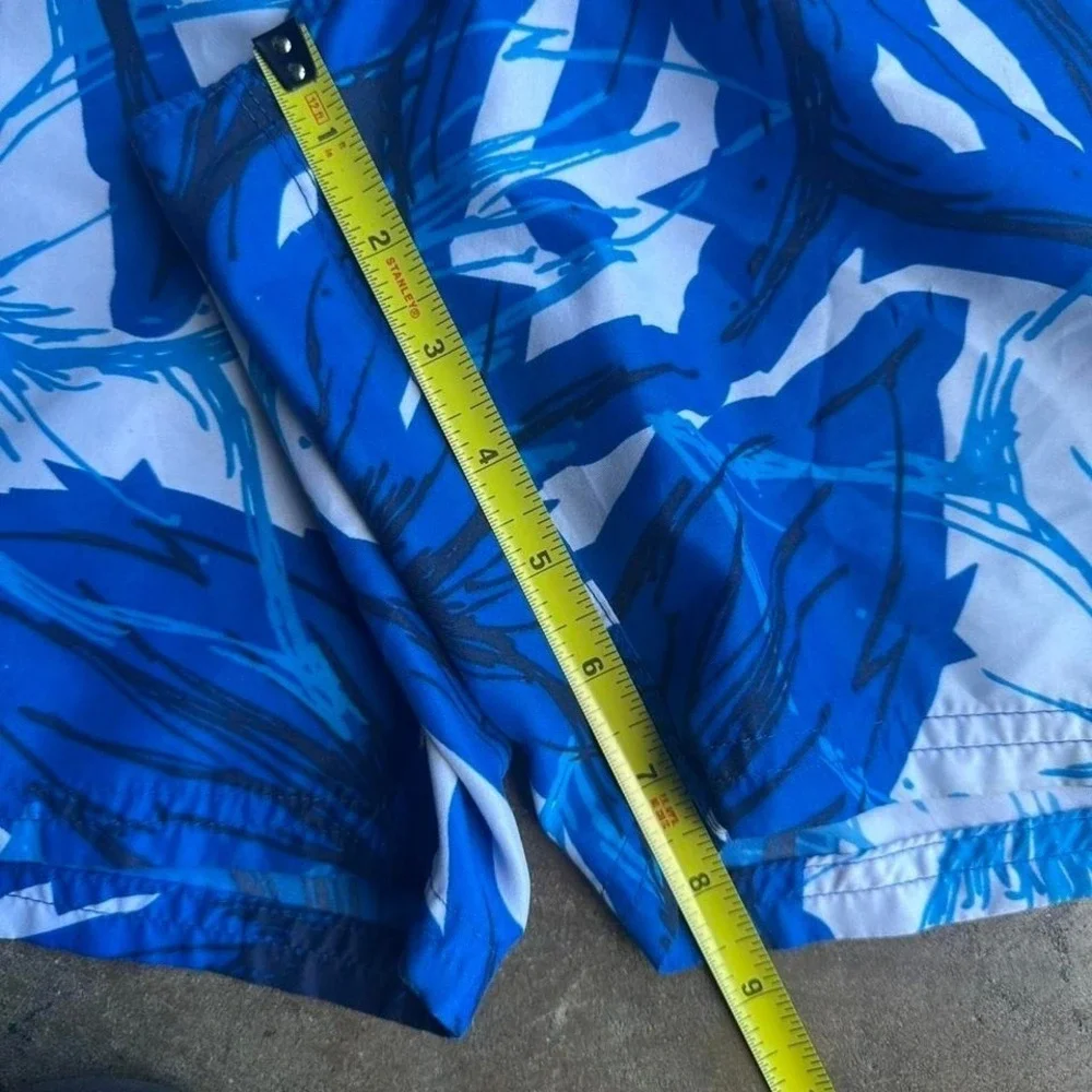 Vintage 2000s Nike blue floral swim trunks size L
